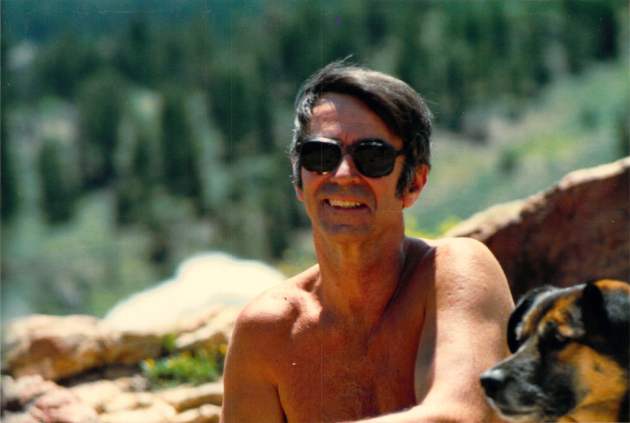 Jack on a beach, with Greta, one of many beloved dogs.